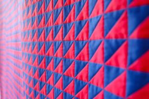 A picture of the artwork "what is normal?" - a pattern of pink and purple triangles