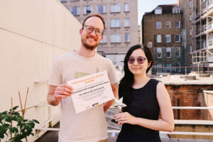 Tobias and Tricia receiving the award