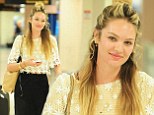 Candice Swanepoel is seen at JFK Airport