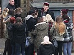 Impossible to get away! James Arthur mobbed by fans as he takes a quick break during X Factor tour rehearsals