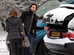 Booted: Sylvain carries the suitcases out of the hotel and pops them in the back of his car