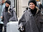 Jennifer Ellison arrives into Euston train station with a large suitcase after 