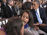 Say cheese: Malia mugged for the camera as Sash tried to capture the perfect moment of her parents kissing