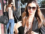 Supermodel Miranda Kerr flaunted her heavenly curves as she strolled down a Hollywood street today 