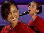 Girl on Fire! Lady in red Alicia Keys sets the stage alight as she takes to her piano to perform at Obama's Inaugural Ball 