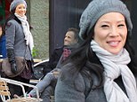 Lucy Liu and Jonny Lee Miller brave the chill as they film Elementary in New York City today 