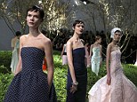 Designer Raf Simons made use of Dior's style blueprint the strapless bodice on pretty structured evening gowns, finishing the look with cropped elfin hair and thick glossy lips